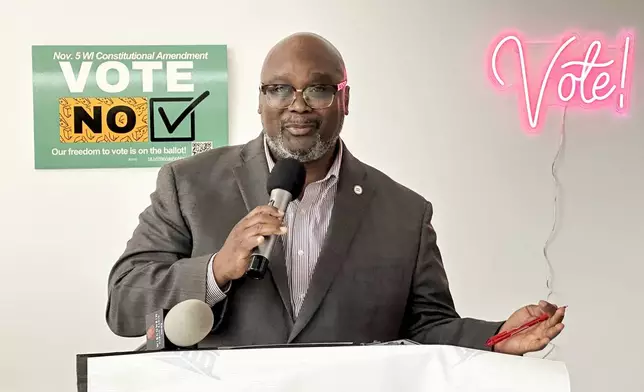 Ruben Anthony, president and CEO of the Urban League of Greater Madison, advocates for in-person, early voting in Wisconsin's capital city on the first day it is available, Tuesday, Oct. 22, 2024, in Madison, Wis. (AP Photo/Scott Bauer)