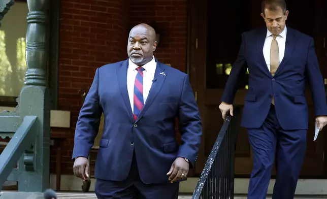 North Carolina Lt. Gov. Mark Robinson arrives at a news conference in Raleigh, N.C., Tuesday, Oct. 15, 2024. (AP Photo/Karl B DeBlaker)