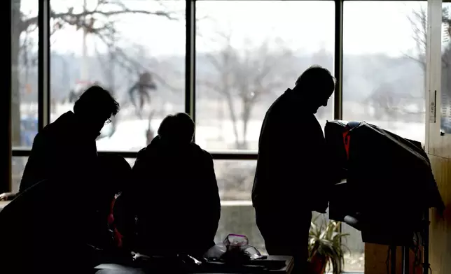 FILE - Residents cast their votes at the Warner Park Community Recreation Center on the first day of early voting, March 21, 2023, in Madison, Wis. (AP Photo/Morry Gash, File)