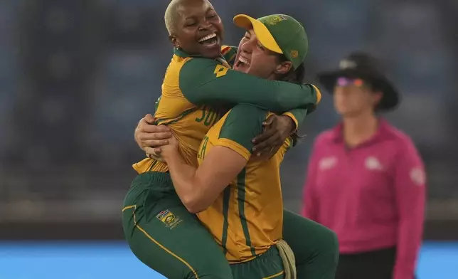 South Africa's Nonkululeko Mlaba, left, celebrates the wicket of New Zealand's Suzie Bates during the ICC Women's T20 World Cup 2024 final match between New Zealand and South Africa at Dubai, United Arab Emirates, Sunday, Oct. 20, 2024. (AP Photo/Altaf Qadri)