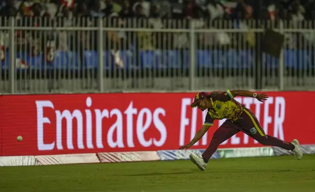 West Indies' Zaida James unsuccessfully attempts to field a ball during the ICC Women's T20 World Cup 2024 semi-final match between New Zealand and West Indies at Sharjah Stadium, United Arab Emirates, Friday, Oct. 18, 2024. (AP Photo/Altaf Qadri)