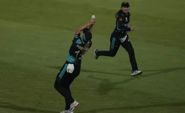 New Zealand's Molly Penfold drops a catch from West Indies' Zaida James during the ICC Women's T20 World Cup 2024 semi-final match between New Zealand and West Indies at Sharjah Stadium, United Arab Emirates, Friday, Oct. 18, 2024. (AP Photo/Altaf Qadri)