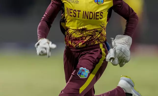 West Indies' Shemaine Campbelle chases a ball during the ICC Women's T20 World Cup 2024 semi-final match between New Zealand and West Indies at Sharjah Stadium, United Arab Emirates, Friday, Oct. 18, 2024. (AP Photo/Altaf Qadri)