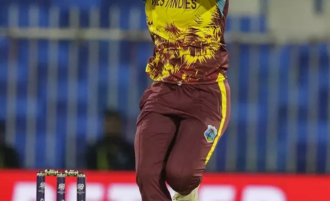 West Indies' Chinelle Henry bowls a delivery during the ICC Women's T20 World Cup 2024 semi-final match between New Zealand and West Indies at Sharjah Stadium, United Arab Emirates, Friday, Oct. 18, 2024. (AP Photo/Altaf Qadri)