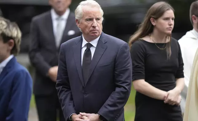 Chris Kennedy, center, son of Ethel Kennedy, departs Our Lady of Victory church following funeral services for Ethel Kennedy, Monday, Oct. 14, 2024, in Centerville, Mass. (AP Photo/Steven Senne)