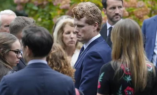 Joseph Kennedy III, center right, grandson of the late Ethel Kennedy arrives at Our Lady of Victory church, for Ethel Kennedy's funeral, Monday, Oct. 14, 2024, in Centerville, Mass. (AP Photo/Steven Senne)