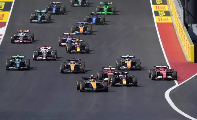 Drivers head into Turn 1 at the start of the U.S. Grand Prix auto race at Circuit of the Americas, Sunday, Oct. 20, 2024, in Austin, Texas. (AP Photo/Eric Gay)