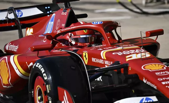 Ferrari driver Charles Leclerc, of Monaco, exits pit row during the F1 U.S. Grand Prix auto race at the Circuit of the Americas, Sunday, Oct. 20, 2024, in Austin, Texas. (Patrick Fallon/Pool Photo via AP)