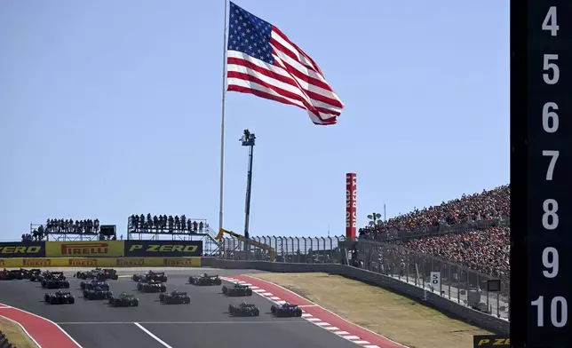 Drivers head into Turn 1 during the F1 U.S. Grand Prix auto race at the Circuit of the Americas, Sunday, Oct. 20, 2024, in Austin, Texas. (Patrick Fallon/Pool Photo via AP)