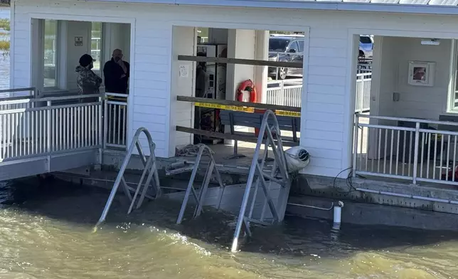 A portion of the gangway which collapsed Saturday afternoon remains visible on Sapelo Island in McIntosh county, Ga., Sunday, Oct. 20, 2024. (AP Photo/Lewis Levine)