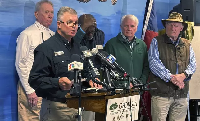 Georgia Department of Natural Resources Commissioner Walter Rabon addresses the media at the Sapelo island visitors center, alongside Georgia State Rep. Buddy DeLoach, Rep. Al Williams, Ga House Speaker Jon Burns and McIntosh Sheriffs Stephen Jesup Sunday, Oct. 20, 2024. (AP Photo/Lewis Levine)