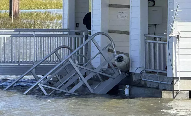 A portion of the gangway which collapsed Saturday afternoon remains visible on Sapelo Island in McIntosh county, Ga., Sunday, Oct. 20, 2024. (AP Photo/Lewis Levine)