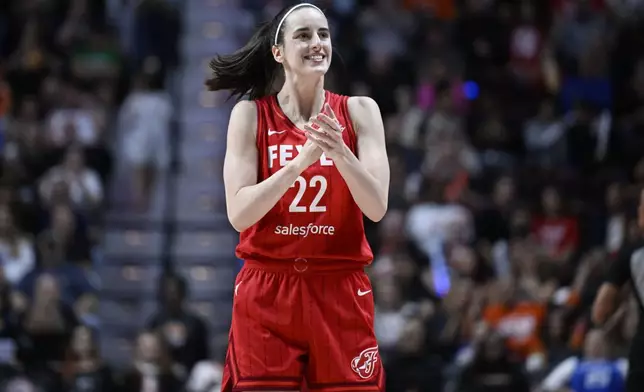 Indiana Fever guard Caitlin Clark (22) reacts during a first-round WNBA basketball playoff game against the Connecticut Sun, Wednesday, Sept. 25, 2024, in Uncasville, Conn. (AP Photo/Jessica Hill)