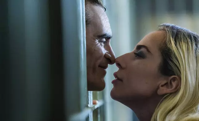 This image released by Warner Bros. Pictures shows Joaquin Phoenix, left, and Lady Gaga in a scene from "Joker: Folie à Deux." (Niko Tavernise/Warner Bros. Pictures via AP)