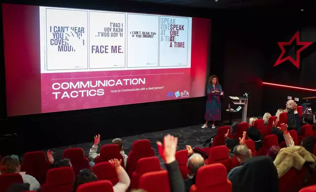 Yvonne Cobb, ambassador for the British Deaf Association, speaks to front of house cinema staff about deaf awareness training, on Wednesday, Oct. 2, 2024 in London.(Photo by Scott A Garfitt/Invision/AP)