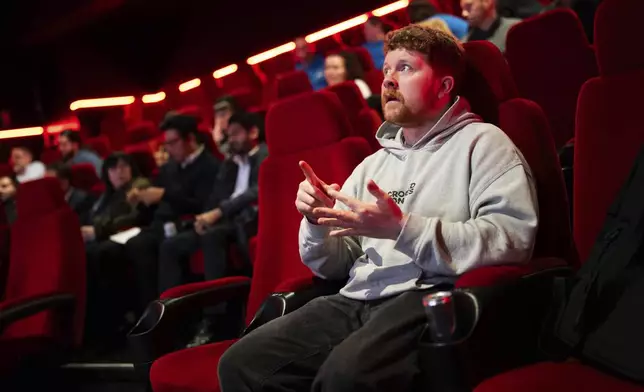 Front of house cinema staff learn British Sign Language at Cineworld Leicester Square, on Wednesday, Oct. 2, 2024 in London. (Photo by Scott A Garfitt/Invision/AP)