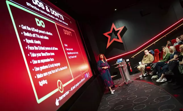 Yvonne Cobb, ambassador for the British Deaf Association, speaks to front of house cinema staff about deaf awareness training, on Wednesday, Oct. 2, 2024 in London.(Photo by Scott A Garfitt/Invision/AP)