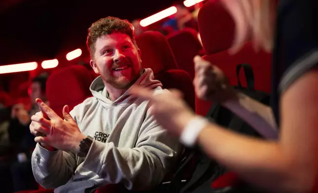 Front of house cinema staff learn British Sign Language at Cineworld Leicester Square, on Wednesday, Oct. 2, 2024 in London. (Photo by Scott A Garfitt/Invision/AP)