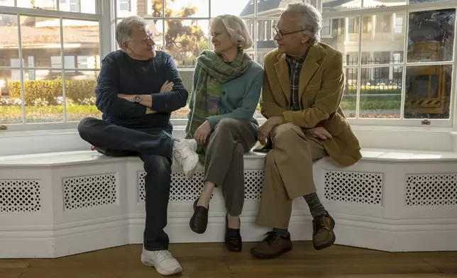 This image released by Sony Pictures Entertainment shows filmmaker Robert Zemeckis, left, with actors Robin Wright, center, and Tom Hanks on the set of "Here." (Sony Pictures via AP)