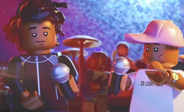 This image released by Focus Features shows lego characters voiced by Jay-Z, left, and Pharrell Williams, in a scene from "Piece By Piece." (Focus Features via AP)