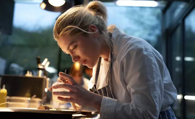 This image released by A24 shows Florence Pugh in a scene from "We Live In Time." (Peter Mountain/A24 via AP)