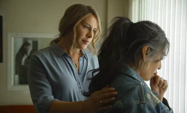 This image released by Netflix shows Karla Sofía Gascón, left, and Adriana Paz in a scene from "Emilia Pérez." (Shanna Besson/Netflix via AP)