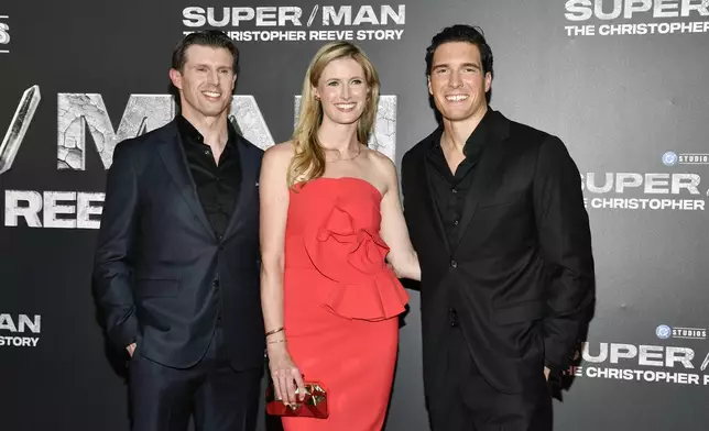 FILE - Matthew Reeve, from left, Alexandra Reeve Givens, and Will Reeve, children of the late actor Christopher Reeve, appear at the premiere of "Super/Man: The Christopher Reeve Story" at the Museum of Modern Art in New York on Sept. 18, 2024. (Photo by Evan Agostini/Invision/AP, File)