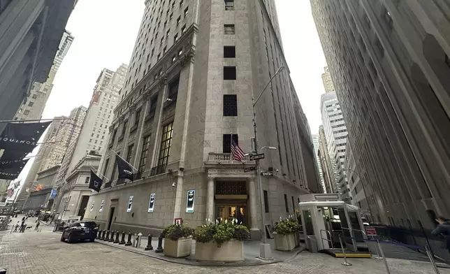 FILE - The entrance to the New York Stock Exchange at Wall and New Streets is shown on Oct. 2, 2024, in New York. (AP Photo/Peter Morgan, File)