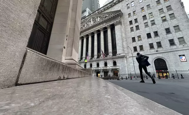 The New York Stock Exchange, rear, is shown on Tuesday, Oct. 8, 2024, in New York. (AP Photo/Peter Morgan, File)