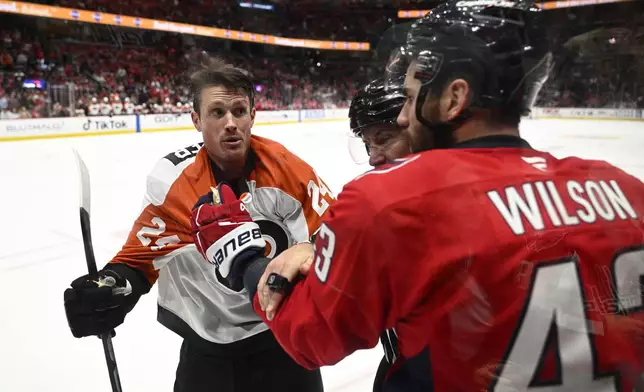 Philadelphia Flyers defenseman Nick Seeler, left, and Washington Capitals right wing Tom Wilson (43) scuffle during the second period of an NHL hockey game, Wednesday, Oct. 23, 2024, in Washington. (AP Photo/Nick Wass)