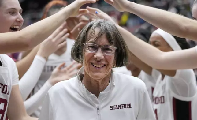 FILE - Stanford coach Tara VanDerveer smiles as players celebrate her 1,202nd victory as a college coach following an NCAA basketball game against Oregon, Friday, Jan. 19, 2024, in Stanford, Calif. (AP Photo/Tony Avelar, File)