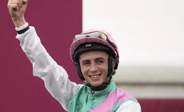 Jockey Rossa Ryan, riding Bluestocking, celebrates after winning the Prix de l'Arc de Triomphe horse race at the Longchamp race track, outside Paris, Sunday, Oct. 6, 2024. (AP Photo/Michel Euler)