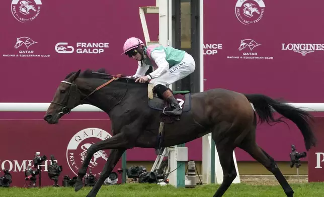 Bluestocking ridden by Rossa Ryan crosses the finish line to win the Prix de l'Arc de Triomphe horse race at the Longchamp race track, outside Paris, Sunday, Oct. 6, 2024. (AP Photo/Michel Euler)