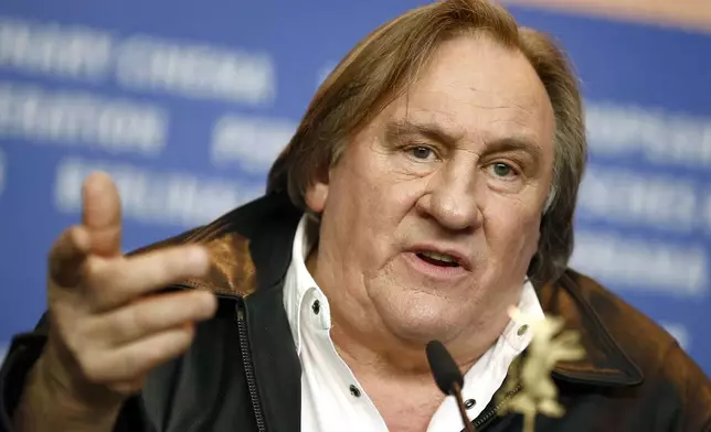 FILE - Actor Gerard Depardieu addresses the media during the press conference for the film 'Saint Amour' at the 2016 Berlinale Film Festival in Berlin, Germany, on Feb. 19, 2016. (AP Photo/Axel Schmidt, File)