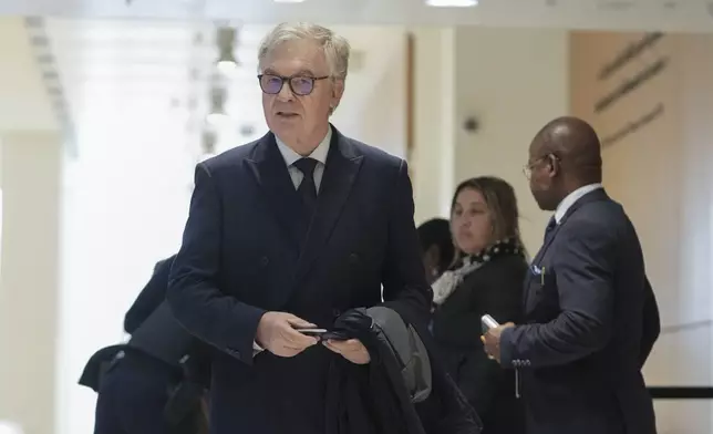 The member of the French far right party Jean-Paul Garraud, front, arrives at the court house in Paris, Monday, Sept. 30, 2024. (AP Photo/Thibault Camus)