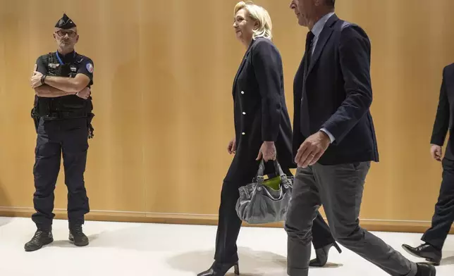 French far-right leader Marine Le Pen leaves the court house after the first day of trial in Paris, Monday, Sept. 30, 2024. (AP Photo/Thibault Camus)
