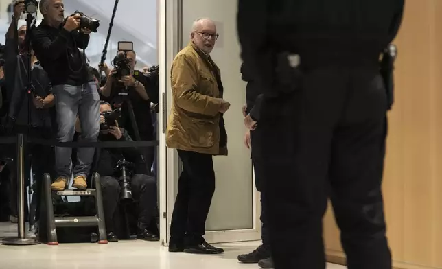 The member of the French far right party Wallerand de Saint-Just, center, arrives at the court house in Paris, Monday, Sept. 30, 2024. (AP Photo/Thibault Camus)