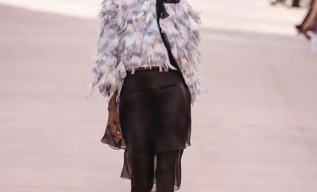 A model wears a creation as part of the Chanel Spring/Summer 2025 collection presented Tuesday, Oct. 1, 2024, in Paris. (Photo by Vianney Le Caer/Invision/AP)