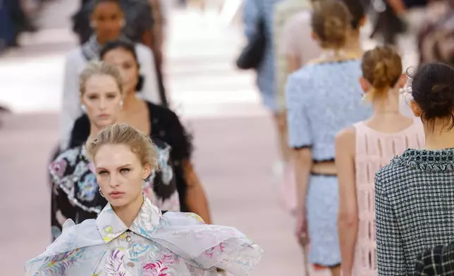 Models wear creations as part of the Chanel Spring/Summer 2025 collection presented Tuesday, Oct. 1, 2024, in Paris. (Photo by Vianney Le Caer/Invision/AP)