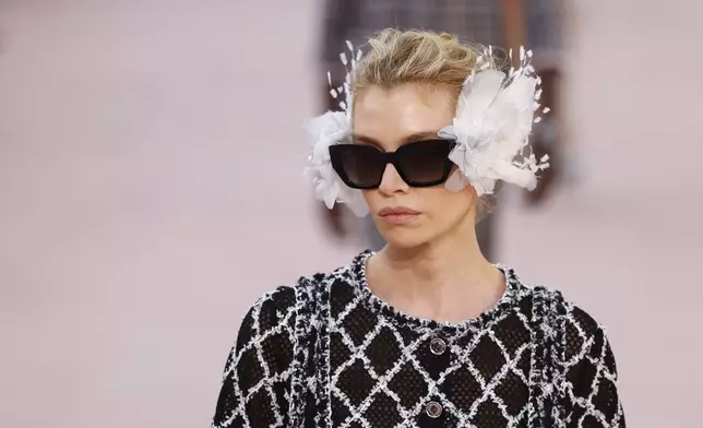 Stella Maxwell wears a creation as part of the Chanel Spring/Summer 2025 collection presented Tuesday, Oct. 1, 2024, in Paris. (Photo by Vianney Le Caer/Invision/AP)