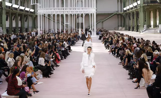 Models wear creations as part of the Chanel Spring/Summer 2025 collection presented Tuesday, Oct. 1, 2024, in Paris. (Photo by Vianney Le Caer/Invision/AP)