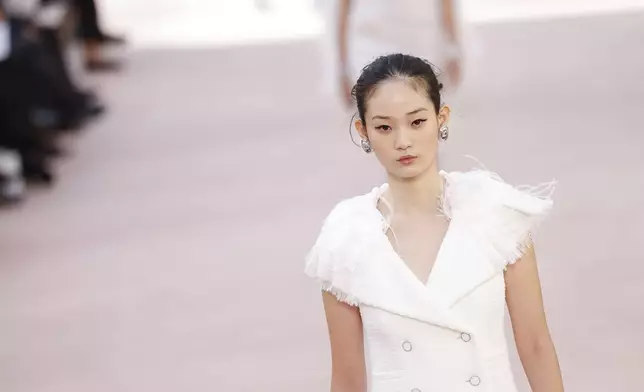 A model wears a creation as part of the Chanel Spring/Summer 2025 collection presented Tuesday, Oct. 1, 2024, in Paris. (Photo by Vianney Le Caer/Invision/AP)