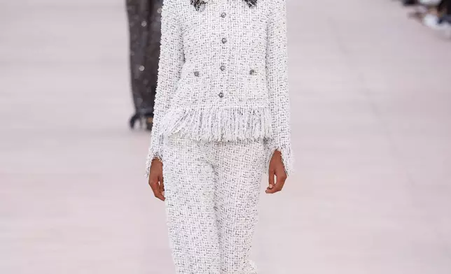 A model wears a creation as part of the Chanel Spring/Summer 2025 collection presented Tuesday, Oct. 1, 2024, in Paris. (Photo by Vianney Le Caer/Invision/AP)