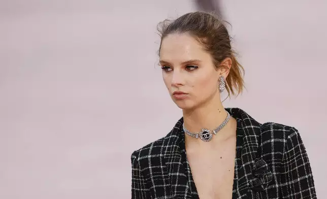 A model wears a creation as part of the Chanel Spring/Summer 2025 collection presented Tuesday, Oct. 1, 2024, in Paris. (Photo by Vianney Le Caer/Invision/AP)