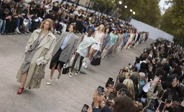 Models wear creations as part of the Stella McCartney Spring/Summer 2025 collection presented Monday, Sept. 30, 2024 in Paris. (Photo by Scott A Garfitt/Invision/AP)