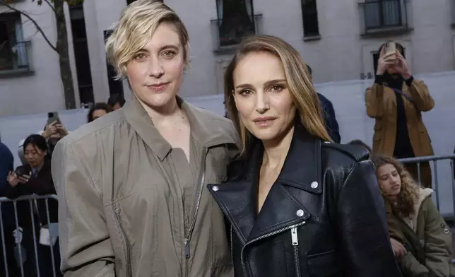 Greta Gerwig, left, and Natalie Portman attend the Stella McCartney Spring/Summer 2025 collection presented Monday, Sept. 30, 2024, in Paris. (Photo by Vianney Le Caer/Invision/AP)