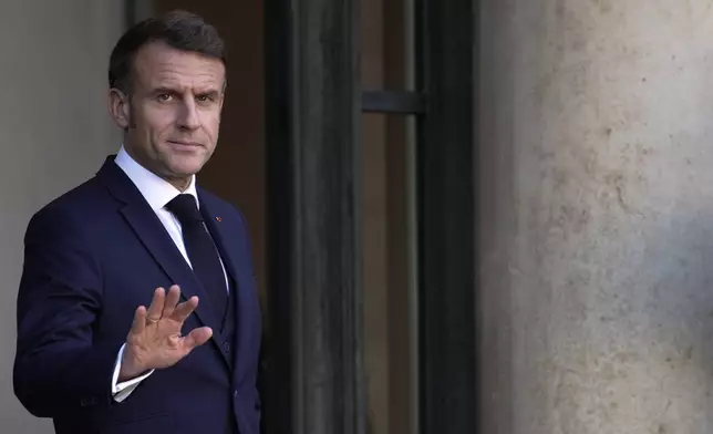 French President Emmanuel Macron gestures Wednesday, Oct. 23, 2024 at the Elysee Palace in Paris. (AP Photo/Louise Delmotte)