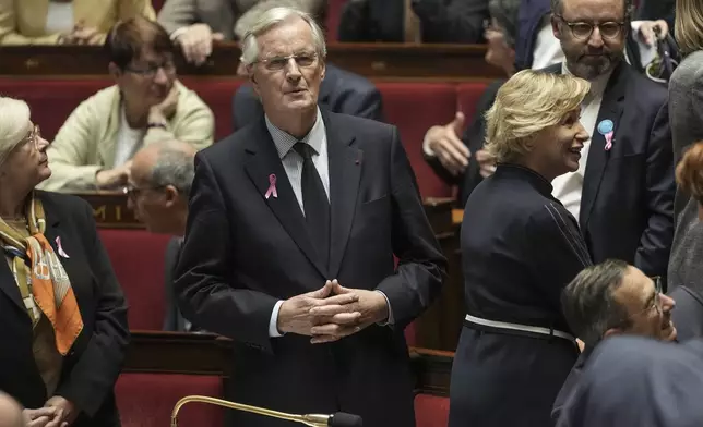 France's Prime Minister Michel Barnier arrives at the National Assembly, in Paris, Tuesday, Oct. 1, 2024. (AP Photo/Thibault Camus)