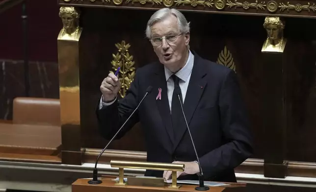 France's Prime Minister Michel Barnier delivers a speech at the National Assembly, in Paris, Tuesday, Oct. 1, 2024. (AP Photo/Thibault Camus)