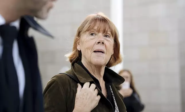 Gisele Pelicot, who was allegedly drugged by her now ex-husband so that she could be raped while unconscious by other men, leaves the court house, in Avignon, southern France, Wednesday, Oct. 16, 2024. (AP Photo/Lewis Joly)